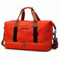 Red nylon duffel bag with black strap and front zip pocket, crossbody strap