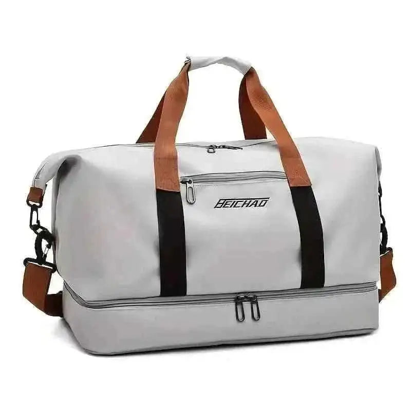 Gray nylon duffel bag with black stripe, top handles, and zip pockets