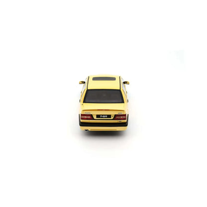 Cream yellow 1:18 die-cast sedan model car, rear view with taillights