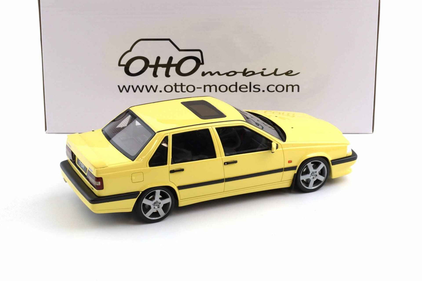 Cream yellow 1:18 Volvo 850 T5R station wagon model, rear-left three-quarter view