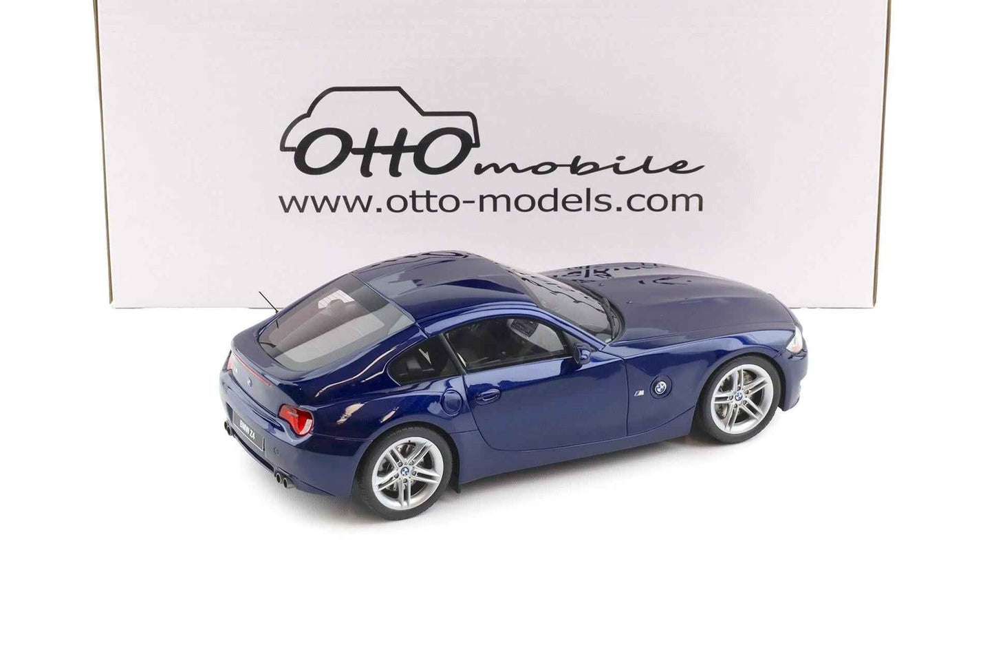 Blue metallic BMW Z4 M coupe die-cast model, rear three-quarter view, silver wheels