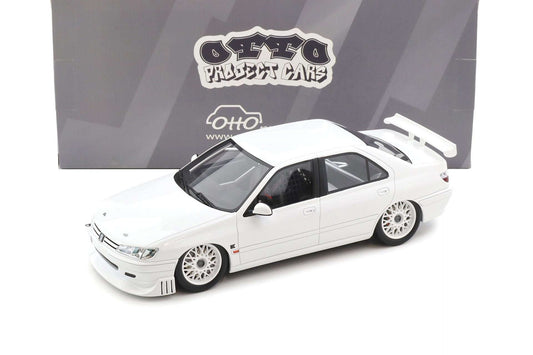 White 1:18 die-cast coupe model car with black windows and sporty wheels