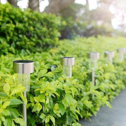 Outdoor solar LED garden lights, clear cylinder bulbs on silver spike stakes