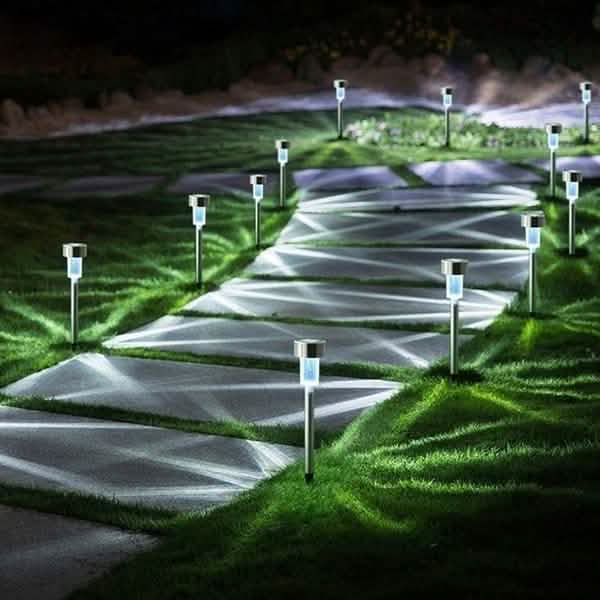 Outdoor solar LED garden lights lining a path with bright white glowing bulbs