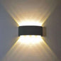 Outdoor waterproof wall light, dark rectangular fixture with warm white two-way light
