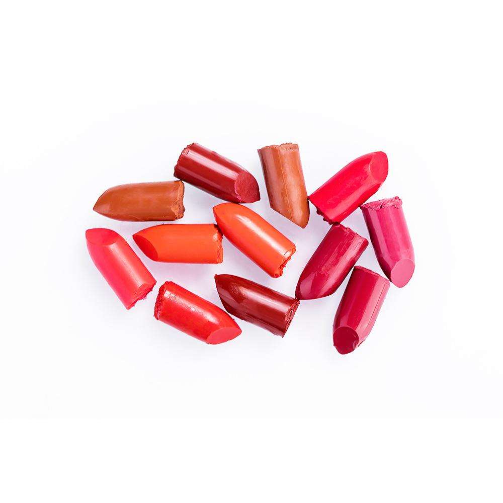Red and pink lip crayon pencil shades, capped and uncapped