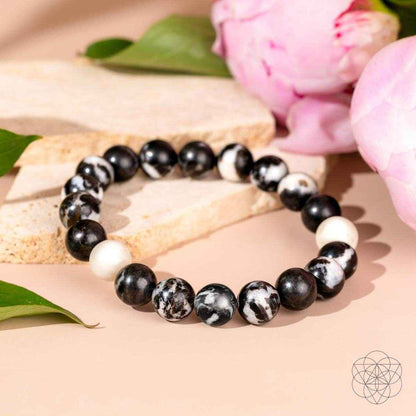 Zebra jasper beaded bracelet with black beads, white accents, and zebra-pattern stones