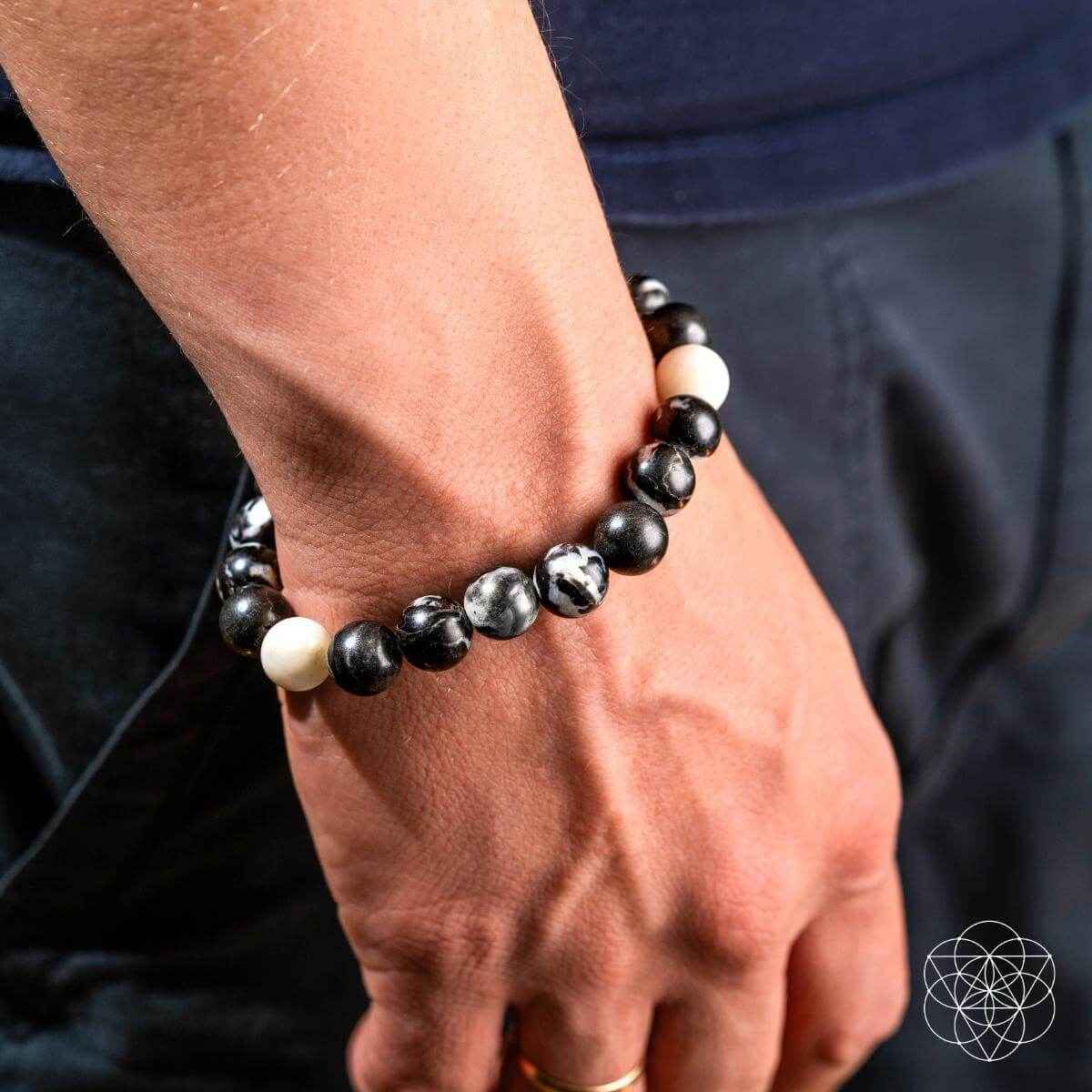 Zebra jasper beaded bracelet on wrist, black and white round stones on elastic fit