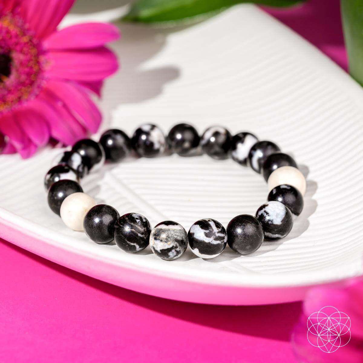 Zebra jasper beaded bracelet with black beads and white spacer beads, elastic fit