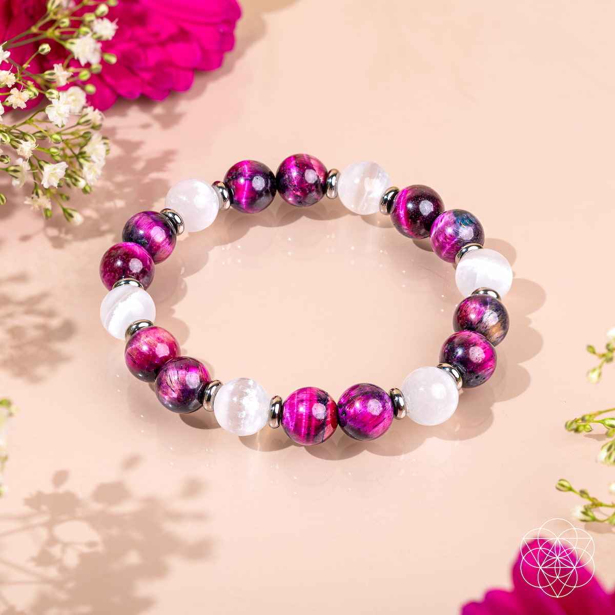 Beaded bracelet with magenta fuchsia beads and white stone accents.