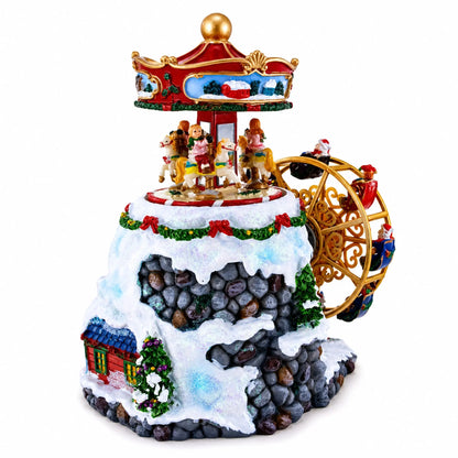 Musical Christmas rotating figurine with carriage wheel, house detail and train elements