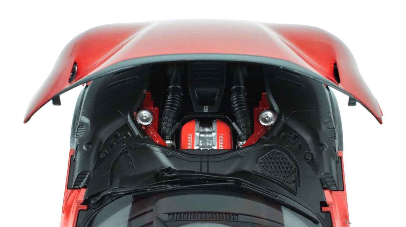 1:18 red metallic sports car model, engine bay view with visible engine parts