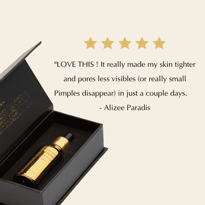 Open black serum box with amber bottle and black dropper inside