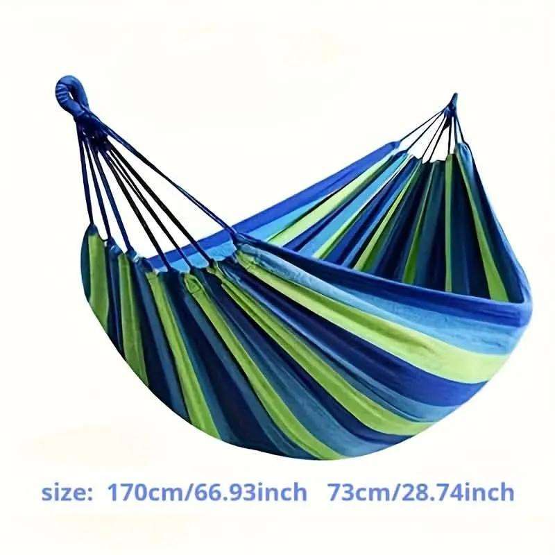 Portable hammock with blue and green striped fabric and tied rope ends