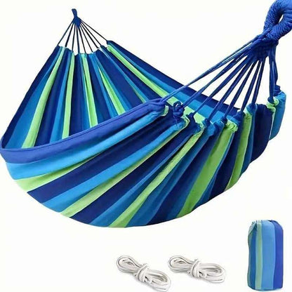 Portable hammock with blue, green, and lime striped fabric and rope hanging loops