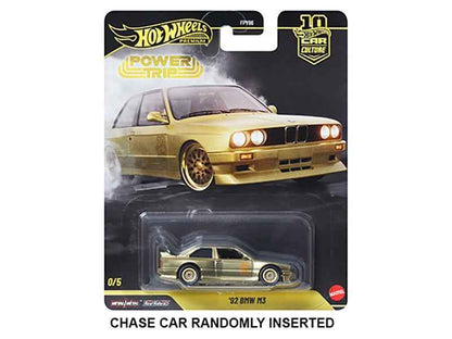 Hot Wheels diecast model car, gold BMW with black grille, carded blister