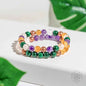 Beaded crystal bracelet with purple, green, orange, clear, and copper-toned beads