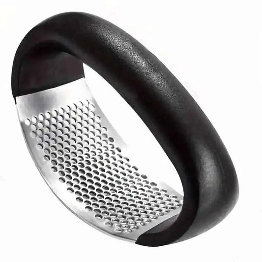 Compact garlic rocker press with black curved handle and stainless perforated grater