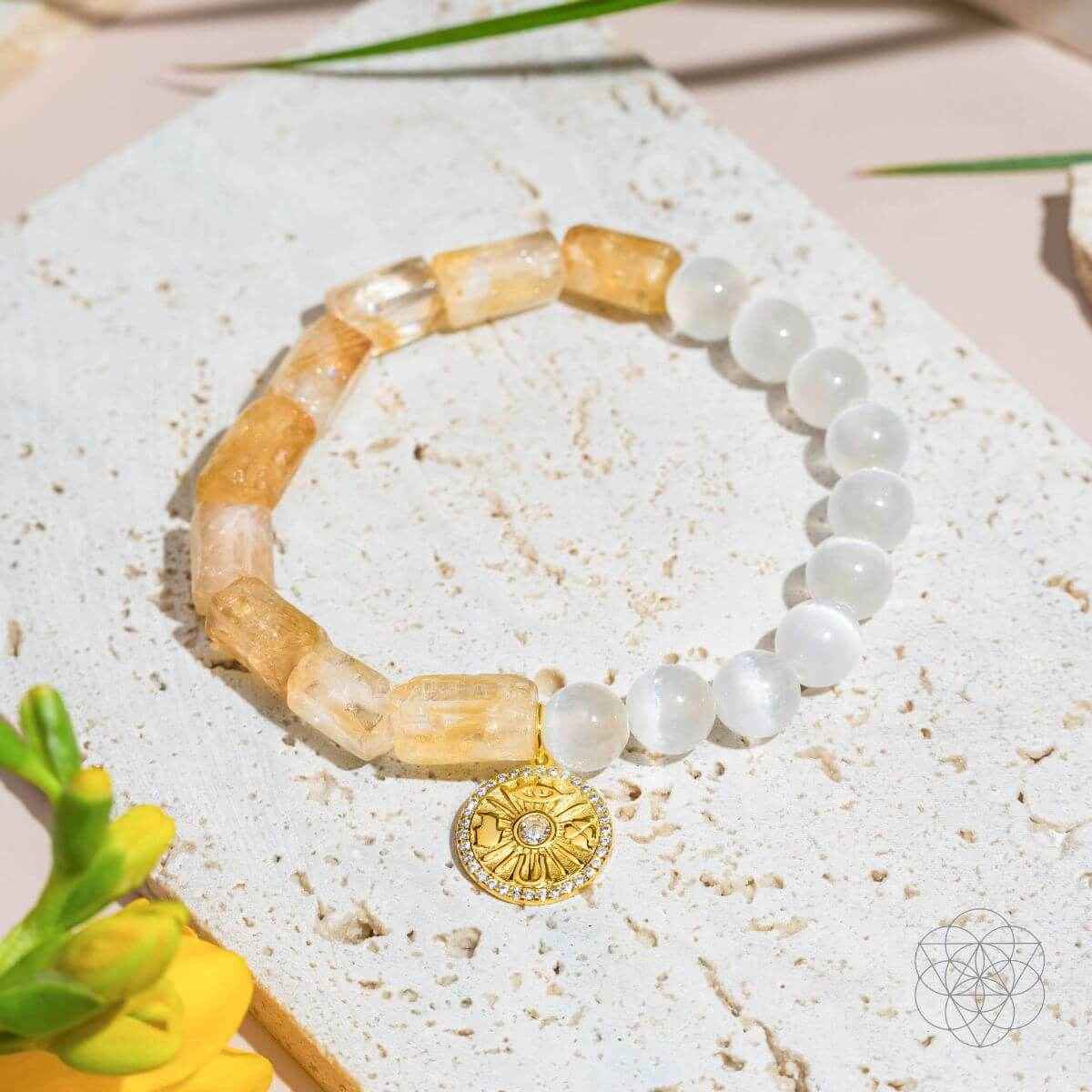 Citrine and selenite beaded bracelet with gold sun medallion charm