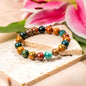Beaded bracelet with ocean jasper-style stones in teal, orange, and dark green