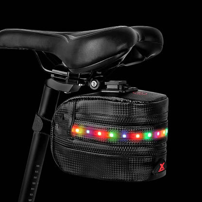 Rear bike saddle bag under black saddle; multicolor LED strip lit along front