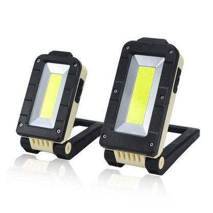Black rechargeable folding LED outdoor light with rectangular COB panel and side handle