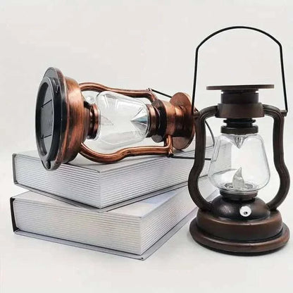 Copper retro kerosene lantern light with clear glass chamber and arched carry handle, side view.