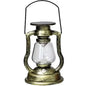 Retro kerosene lantern light with gold frame, clear glass chimney, and carry handle.