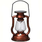 Retro kerosene lantern light with copper frame, clear glass chimney, and carry handle.