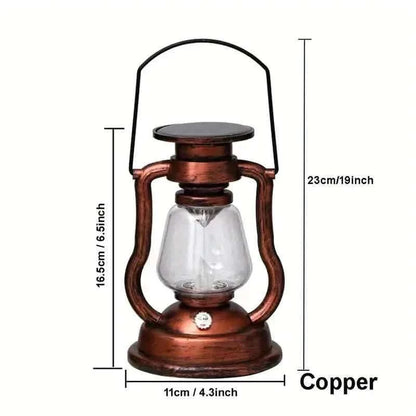 Copper retro kerosene lantern light with clear glass chamber and black top, front view.