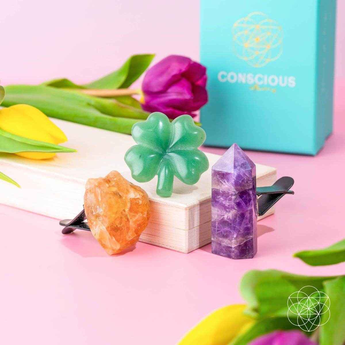 Desk crystal kit display with green clover, purple tower, orange crystal on clips