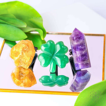 Crystal kit display with green clover and purple towers plus orange stones in holders