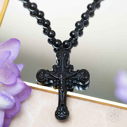 Black beaded cross pendant necklace with detailed ornate crucifix centerpiece