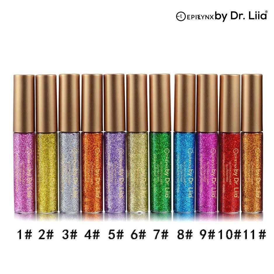 Row of glitter eyeliner tubes with gold caps in multiple colors