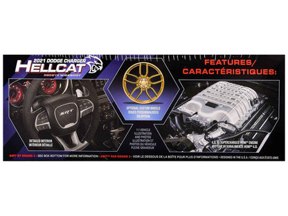 Model kit box panel with gold wheel graphic and engine parts diagram