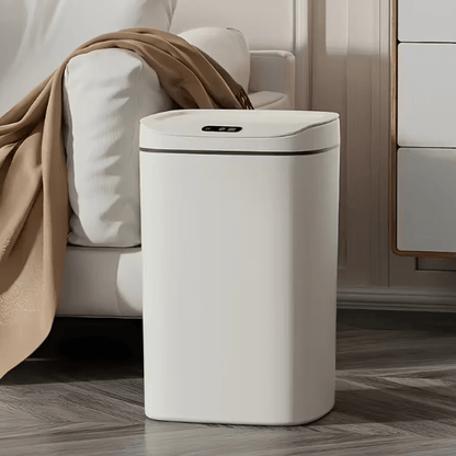 White hands-free trash can with closed lid and small control panel on top