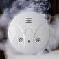 Portable photoelectric smoke and fire alarm, white with alarm light and speaker vents
