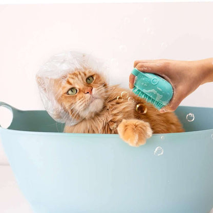 Teal pet bath scrubber brush massager being used on a cat in a tub