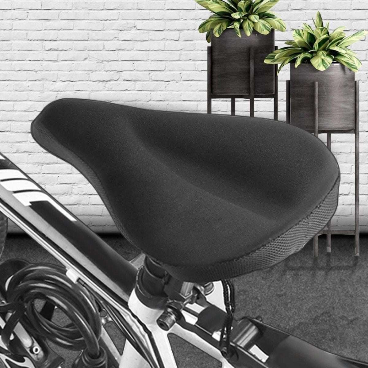 Bike seat cushion cover on bicycle seat, black soft gel pad with textured side grip