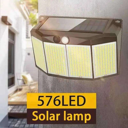 Outdoor solar wall light with solar panel, two front lenses, and three illuminated LED panels