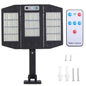 Solar wall light with three LED panels on base stand, black outdoor motion lamp