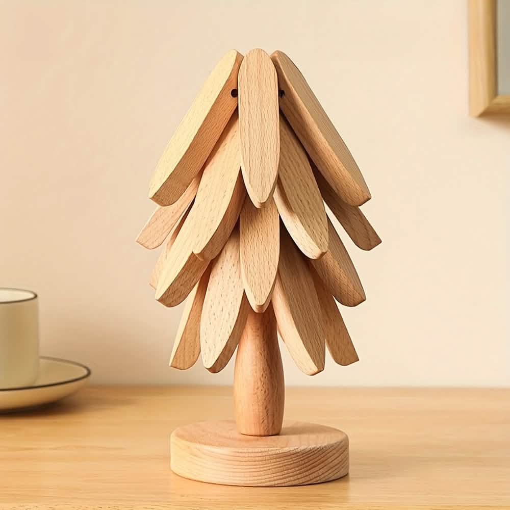Light wood tree coaster with layered leaf cutouts and round base.