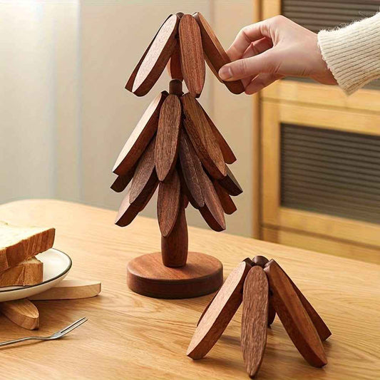 Dark wood tree-shaped coaster with stacked leaf-like pieces on a round base.