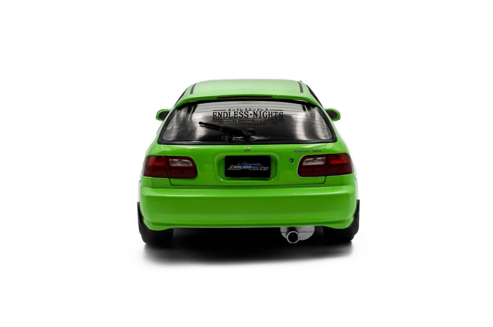Green hatchback die-cast model car, rear view showing tail lights and rear bumper.
