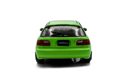 Green hatchback die-cast model car, rear view showing tail lights and rear bumper.
