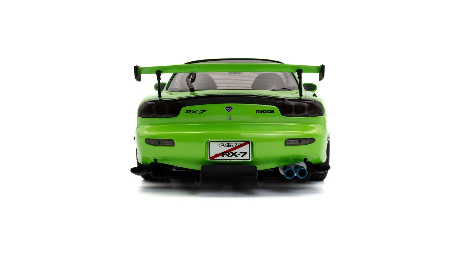 Neon green die-cast sports car model rear view with large spoiler and exhaust tips