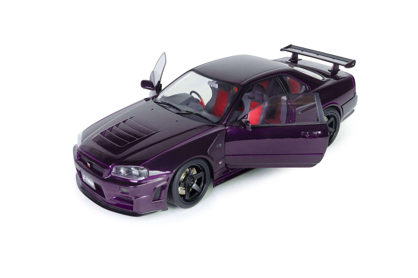 Front three-quarter view of purple 1:18 Nissan Skyline GT-R die-cast model, angled hood