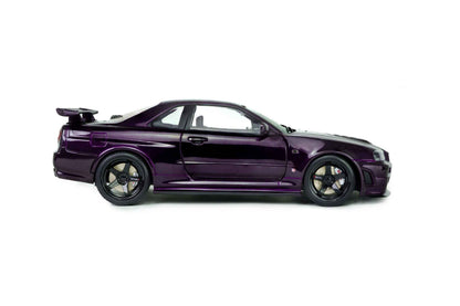 Side view of purple 1:18 Nissan Skyline GT-R die-cast model with hood vents and front splitter