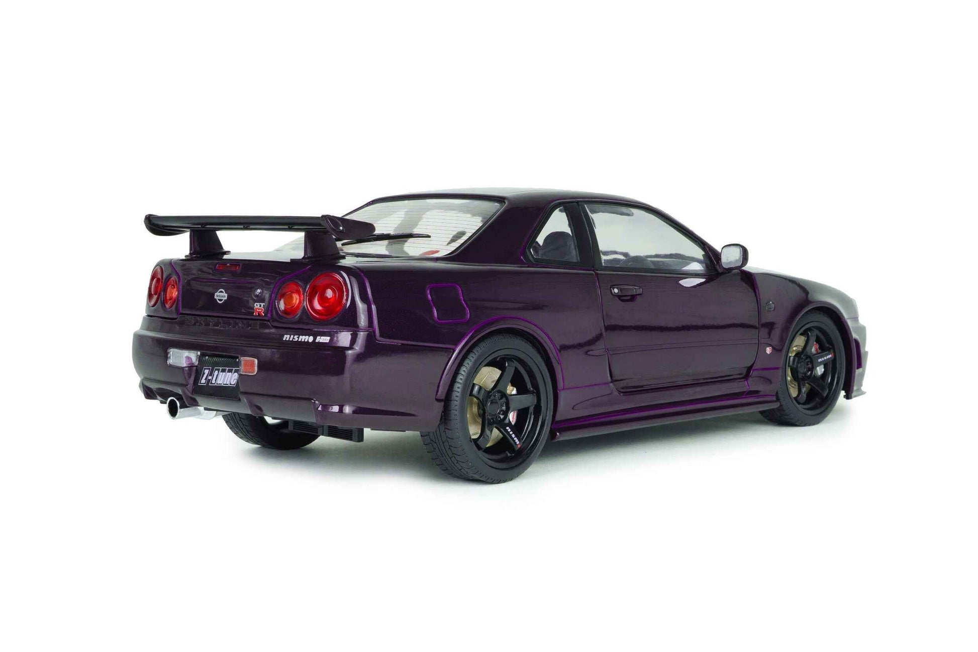 Three-quarter rear view of purple 1:18 Nissan Skyline GT-R die-cast model, black wheels