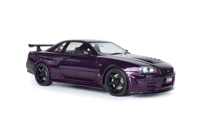 Front three-quarter view of purple 1:18 Nissan Skyline GT-R die-cast model with headlights on